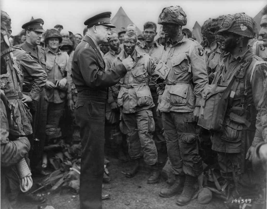 Famous photo of Eisenhower visiting paratroopers before D-day invasion.