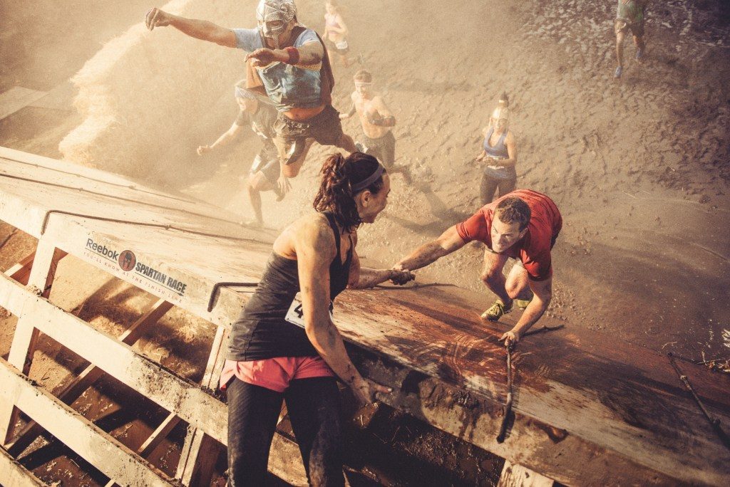 The All The Way Leader helps others move ahead. Photo credit - Reebok Spartan Race