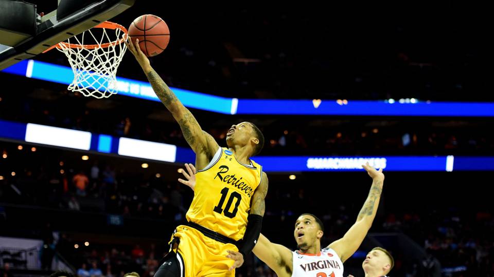 Jairus Lyles scores one of his many baskets on the usually tough UVa defense.