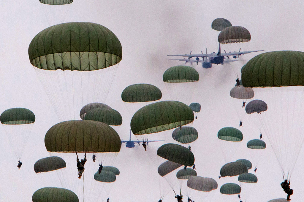 Paratroopers with the 82nd Airborne jump from C-130 Hercules aircraft during a mass-tactical airborne training exercise which included over a thousand paratroopers. (U.S. Army photo by Sgt. Michael J. MacLeod)